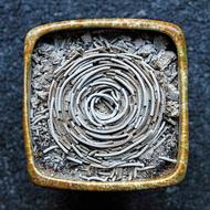 buddhist spiral shape incense in burner