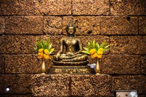 Temple Suwan statue and flowers