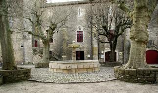 stone fountain in medieval village, france, Sainte-Eulalie-de-Cernon