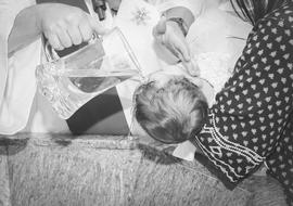 black and white photo of baby baptism