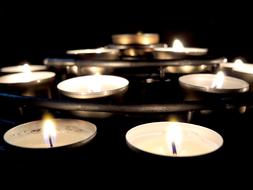 catholic candles in church in the dark