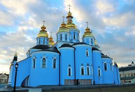 cloudy sky over blue orthodox cathedral