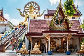beautiful temple and golden buddha statue on Koh Samui, Thailand