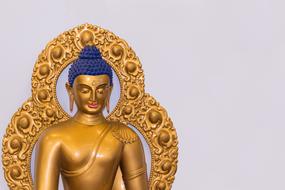 golden buddha Statue with blue hair