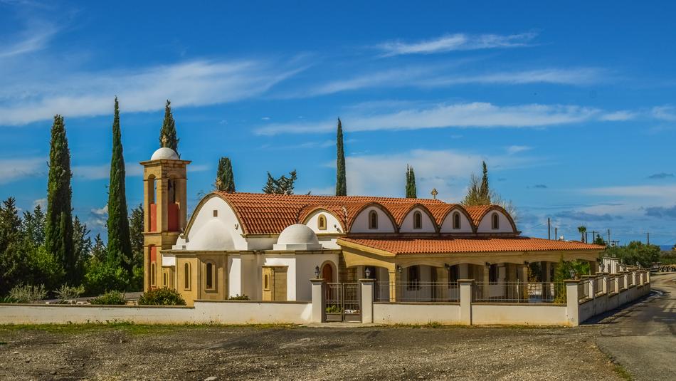 Beautiful and colorful church, among the trees in Paphos, Cyprus, Greece