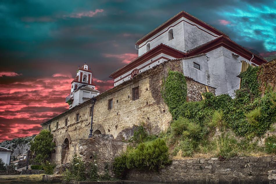 colorful sky over church in cadiz