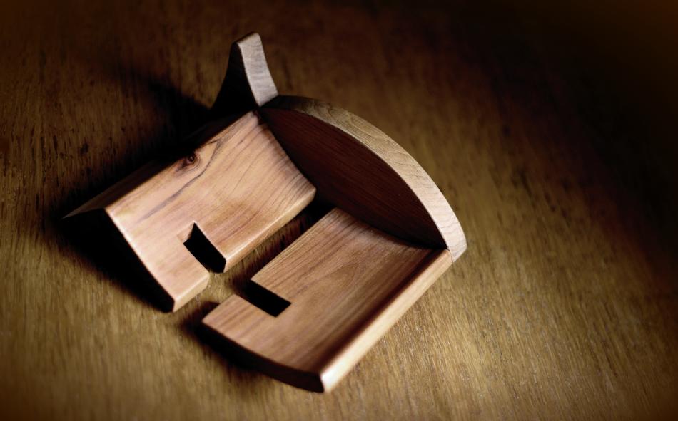 wooden shape with carved cross