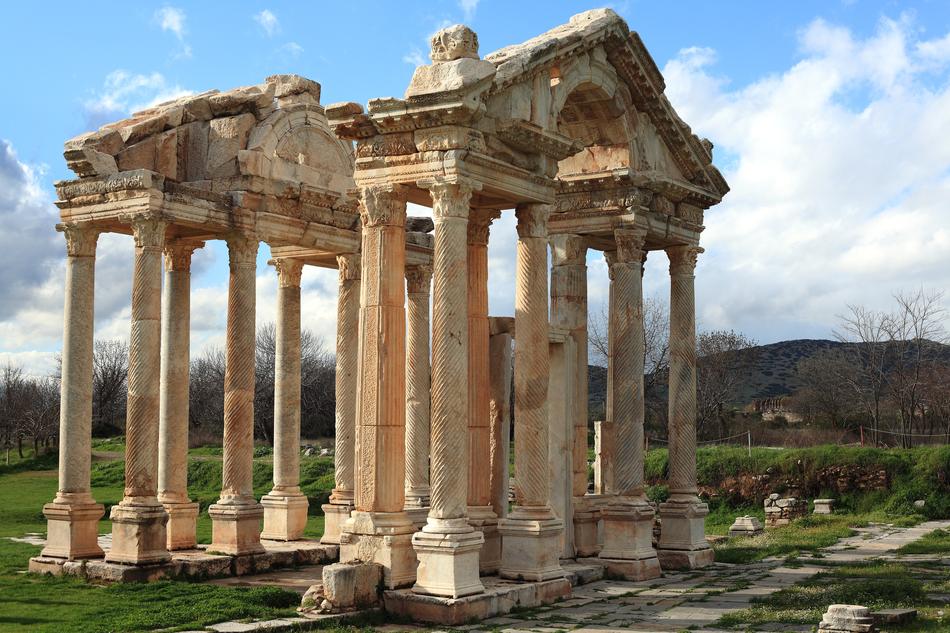 Beautiful, old temple, among the colorful plants in İzmir, Turkey
