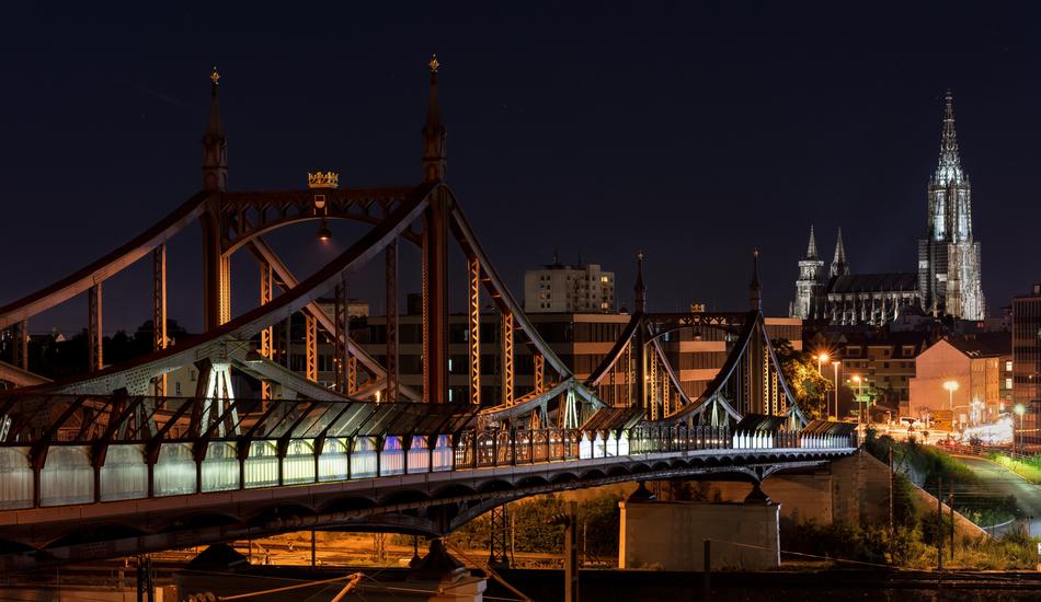 cityscape of the Münster Bridge at night in Ulm, Germany