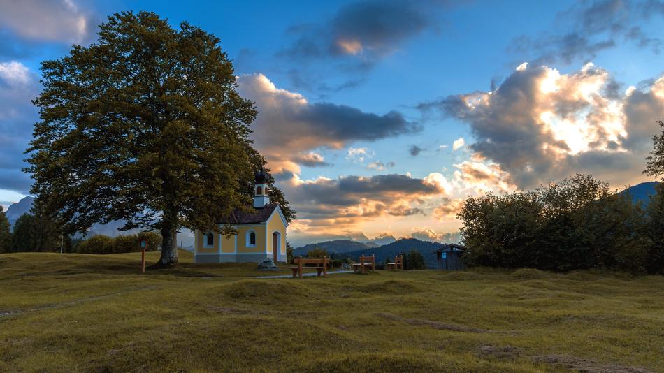 distant view of the chapel under the tree at dusk