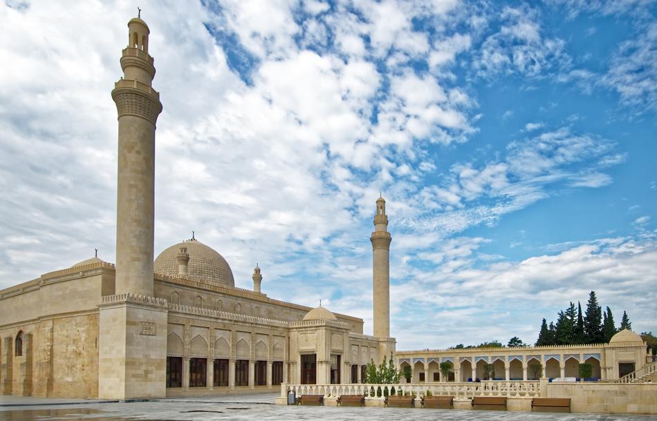 Beautiful Juma Mosque in Shamakhy, Azerbaijan, under the blue sky with white clouds