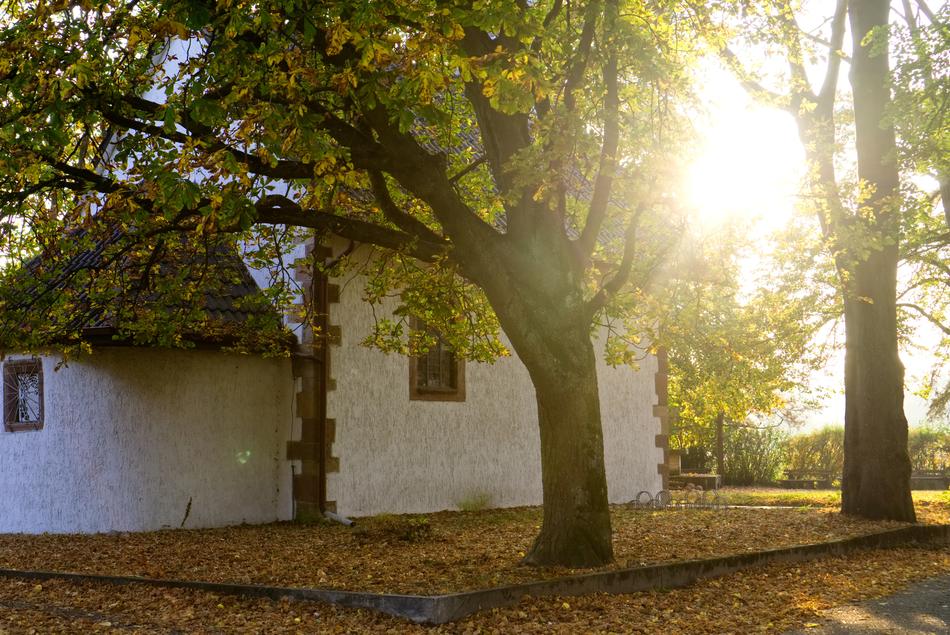 bright sun behind the walls of the white chapel