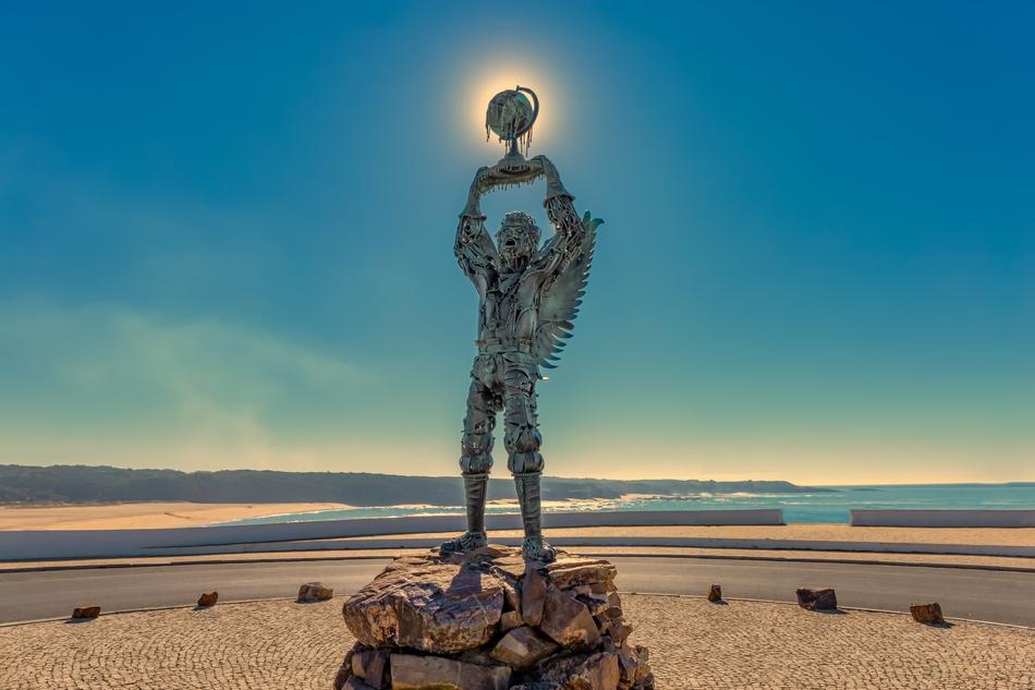 bronze sculpture of the Archangel Michael on the beach