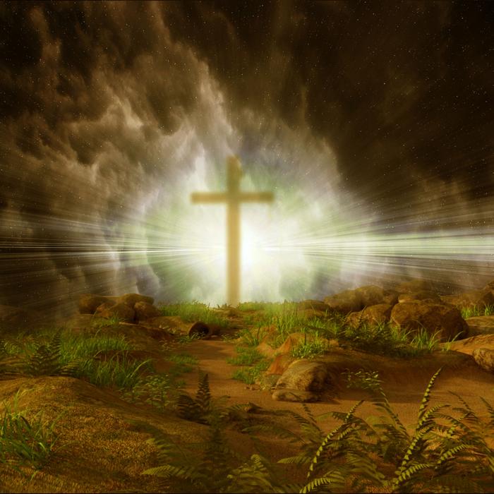 Silhouette of the cross, in smoke, in colorful light