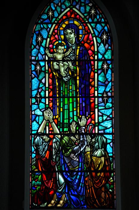 Beautiful and colorful, stained glass with Mary, in the church