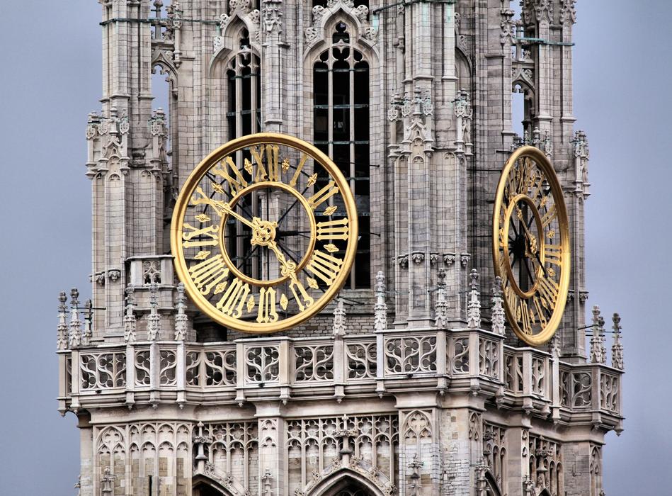 clock on the tower of the cathedral in flanders