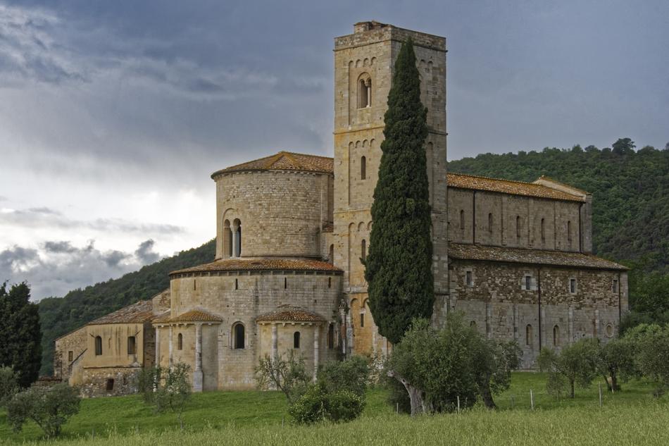 church under dark clouds in tuscany