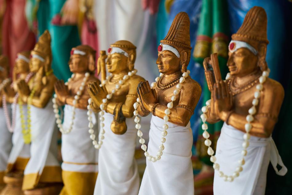 Beautiful, glossy, gold statues, with the beads, in Thailand d