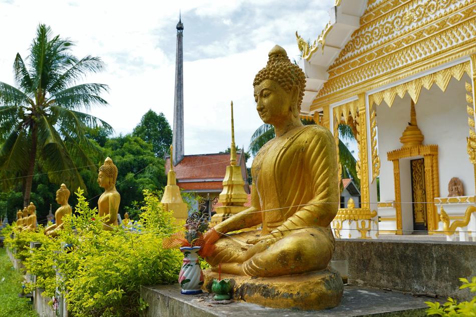 meditating golden Buddha in temple