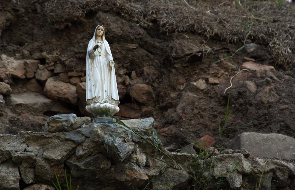 Religion Saint Statue on rock