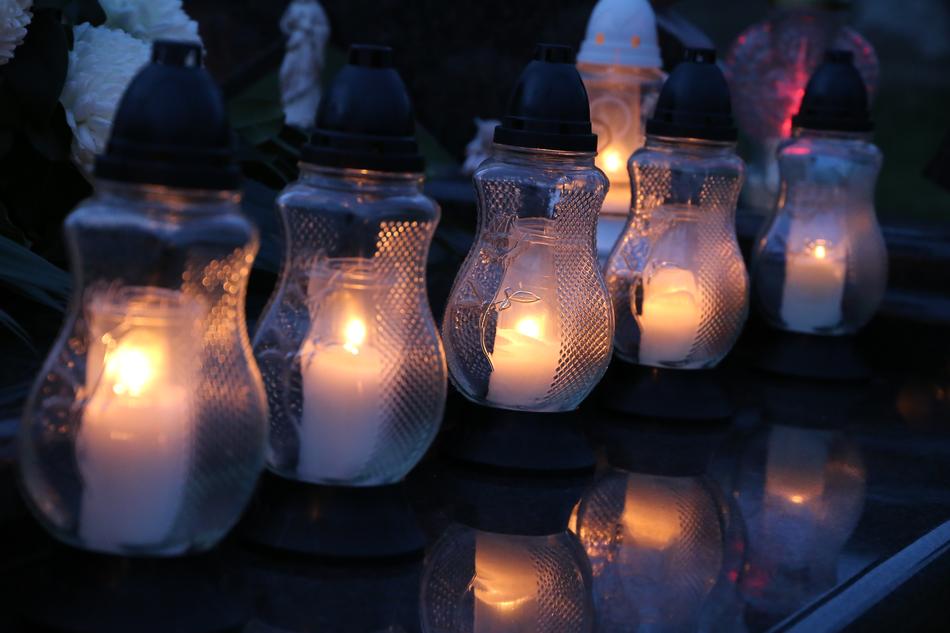 Beautiful white candles of the All Saints, with reflections