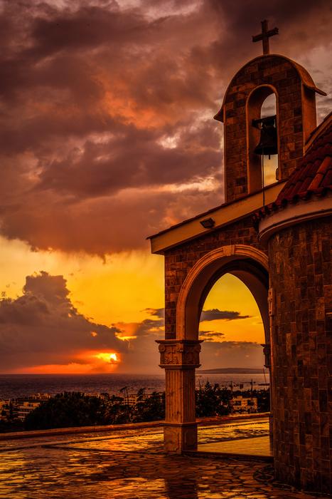 arch near the church at dusk