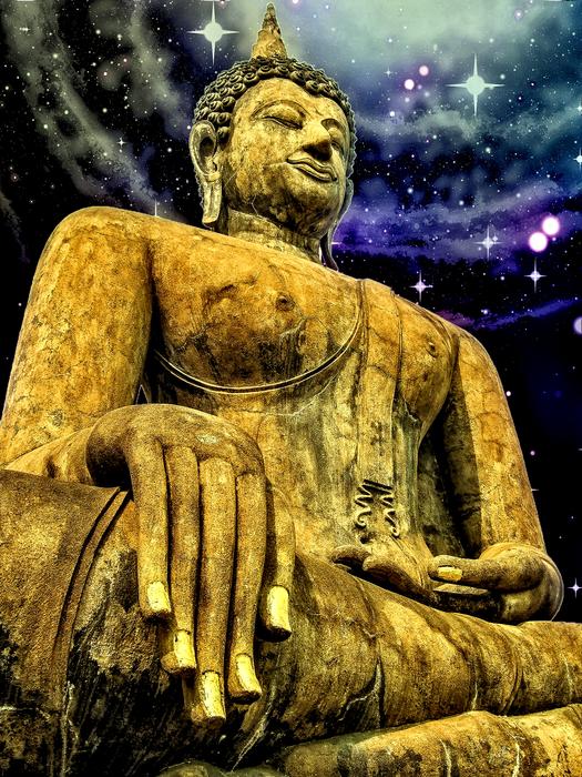 large golden buddha statue under the sky in the stars
