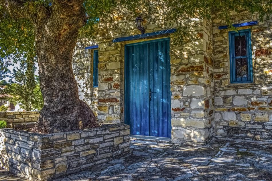 blue entrance doors of a church in the village of Kato Drys, Cyprus