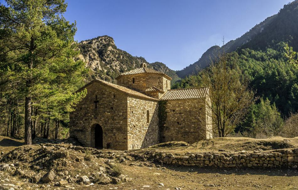 stone church in the mountains on a sunny day