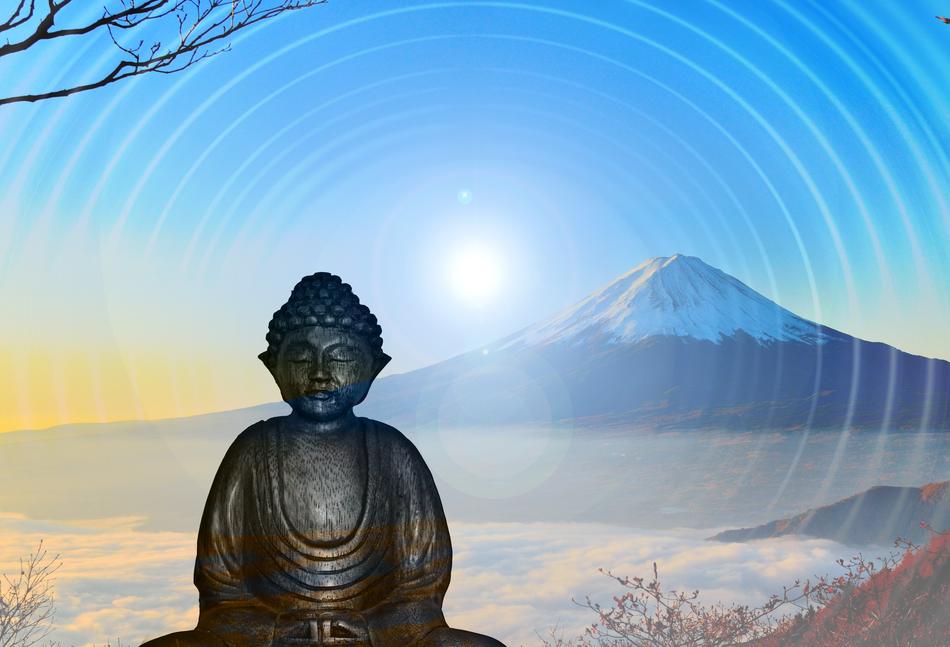 Buddha statue on the background of a snowy mountain
