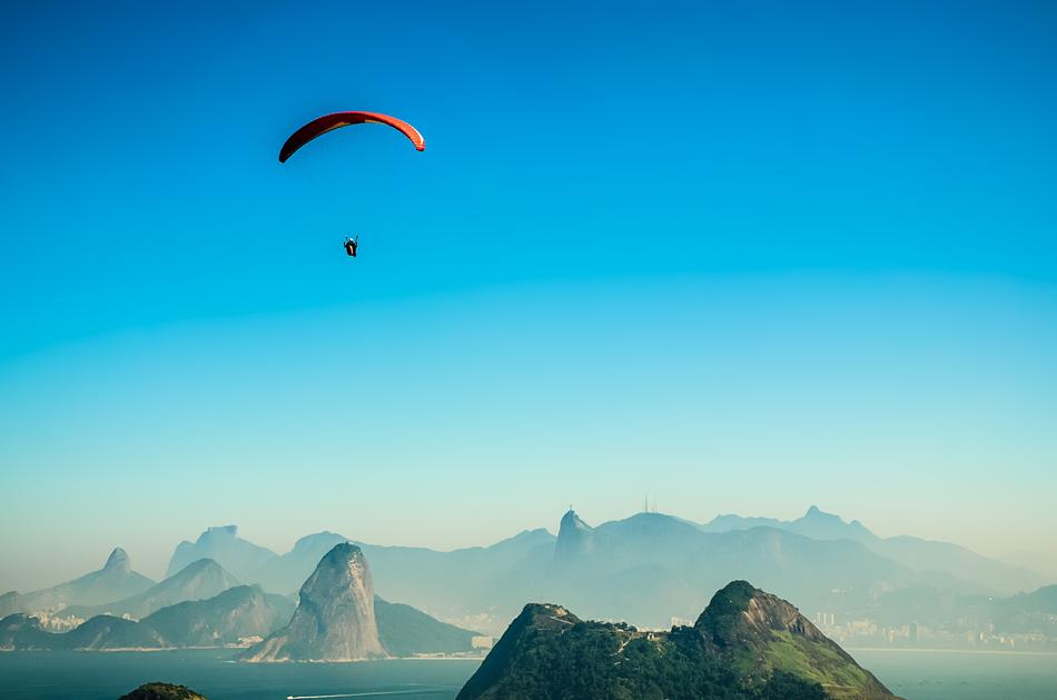 Colorful paraglider above the colorful landscape in Rio De Janeiro