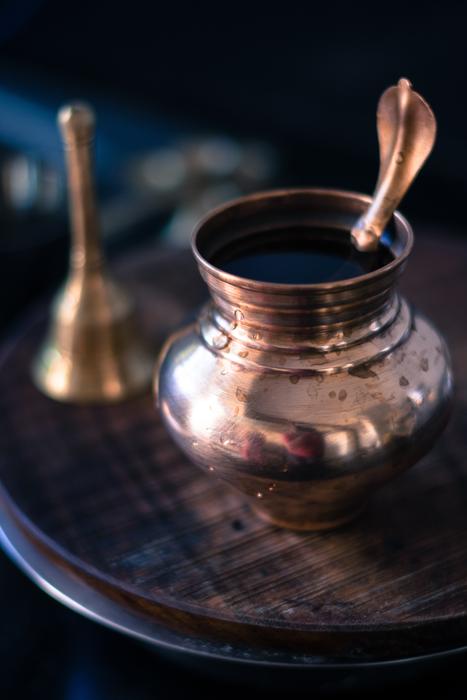 hindu water pot and bell
