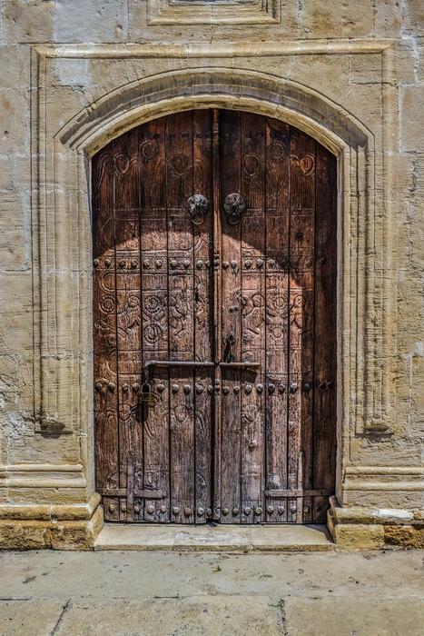 Beach church with wooden door in Athienou, Cyprus