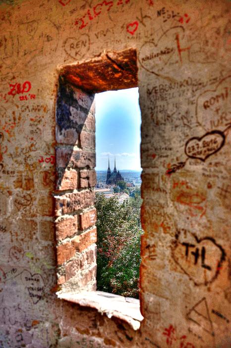 drawings on a brick wall near the window