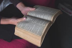 open bible in hand
