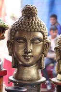 Shiny statue of the face of Buddha