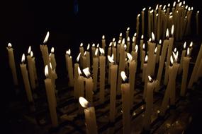 Church candles light the flame