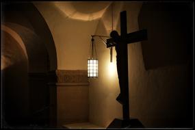lamp above the cross with a crucifix in the interior
