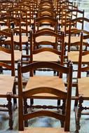 rows of wooden chairs in church