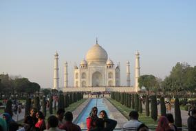 tourists in front of tajmahal at dusk