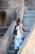 sadhu on the stairs in india