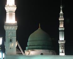 Mosque Prophet with a green roof at night