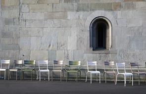 chairs near the church wall in zurich