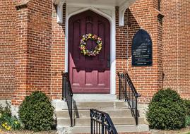 pink entrance doors in the village church