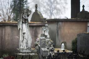 Old statues with angel on the cemetery