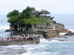 People on the beautiful and colorful Tanah Lot Temple in Bali, Indonesia