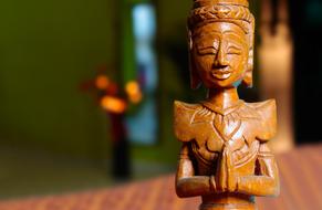 wooden meditating Buddha statue