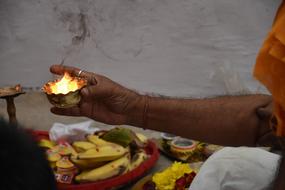 Buddhist monk with candlestick