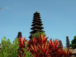 Beautiful Taman Ayun Temple among the colorful plants in Bali, Indonesia