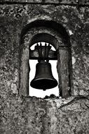 Black and white photo of the bell in the bell tower of the monastery